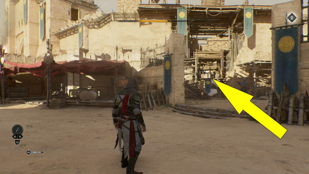 Go through the opening inside the wooden scaffolding to enter The Great Garrison.