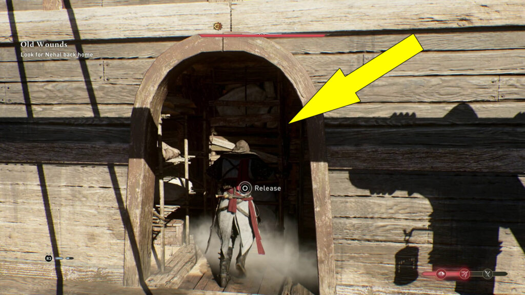Pull the shelf blocking the entrance all the way to the back.