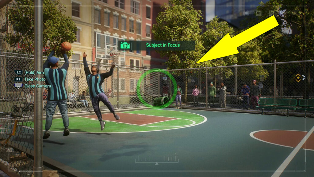 Take a picture of the two men playing basketball on the court.