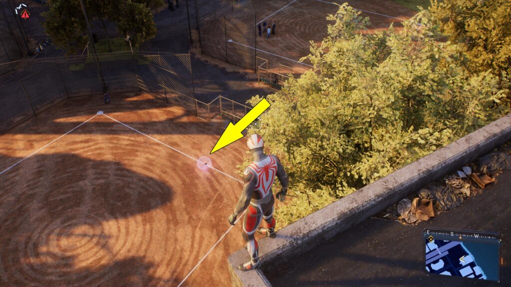 The second Spider-Man 2 Downtown Queens Spider-Bot is on a baseball court.